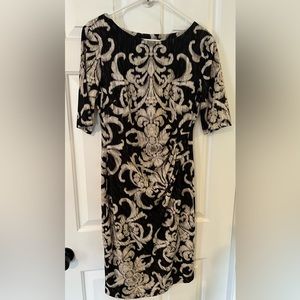 Dress Barn. Mid-length dress. New without tags. Size 6.